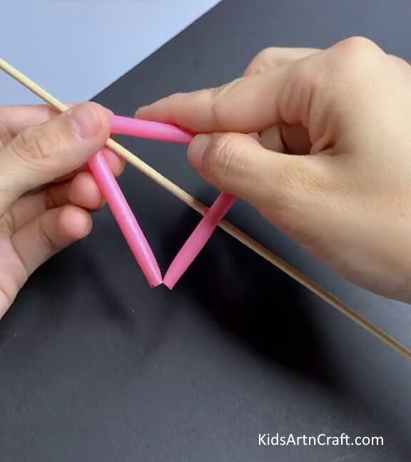 Folding The Ends Of The Straw-Crafting a straw toy is an amusing activity for kids.