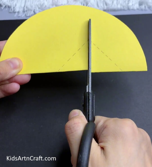 Cutting The Lines - Step-by-step guide to creating a lemon and chick out of paper for the spring.