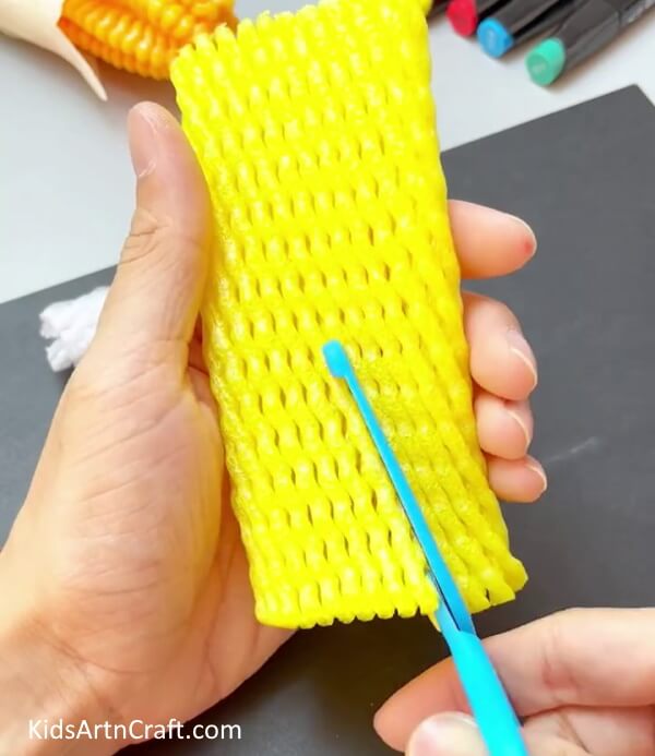 Taking  Yellow Foam Net - Create a Corn Craft Using a Fruit Foam Net