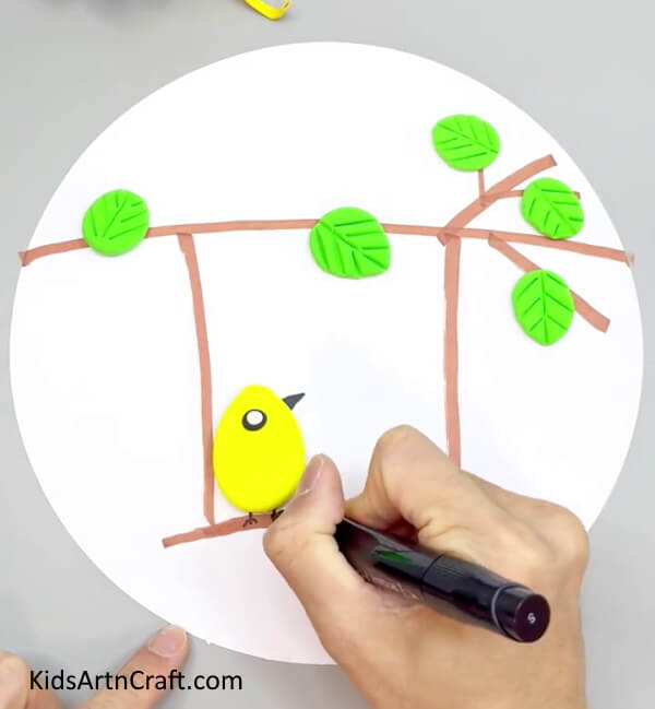 Drawing Beak and Legs Using A Black Marker - Delightful Clay Avian Artworks For Kids To Make In Their Home