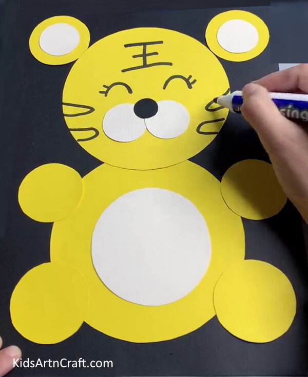 Drawing Black Strips On Face - An uncomplicated paper tiger crafting concept for little ones.