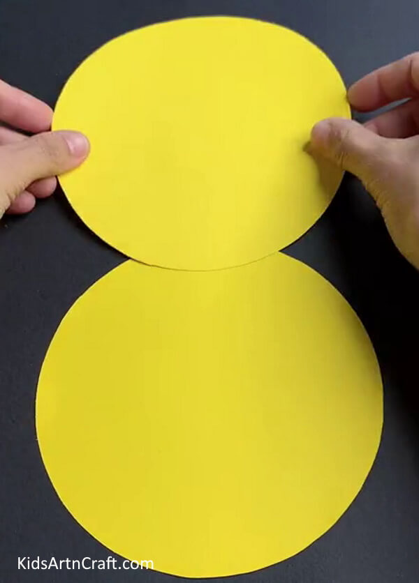 Pasting Another Yellow Circle - A do-it-yourself paper tiger craft project for little ones. 