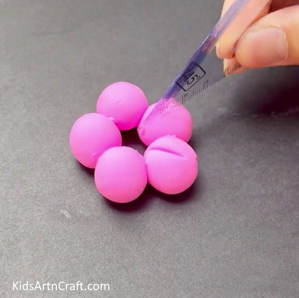 Making Cuts On The Balls - A Kid-Friendly Guide to Craft Clay Blossoms Easily
