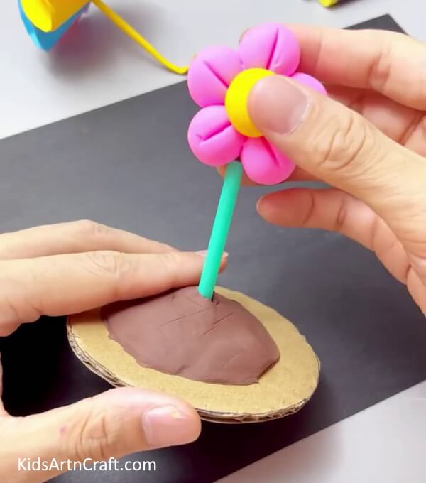 Inserting The Straw In The Flower - Learn to Form Clay Blooms Easily with this Step-by-Step Guide 
