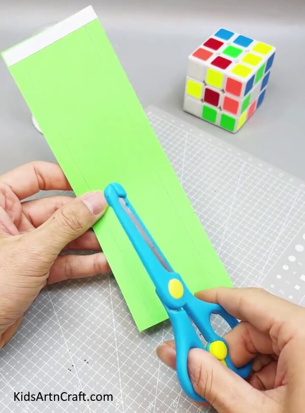 Cutting Side Strips From Green Rectangle Paper - Crafting a Frog with Paper