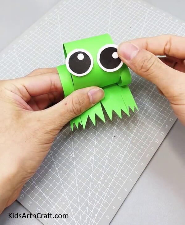 Pasting Eyes and Cutting Legs - Putting Together a Frog with Paper