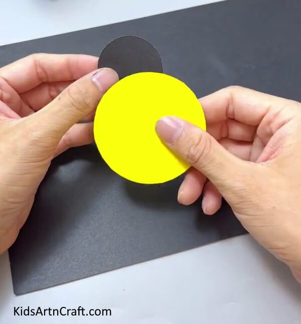 Pasting A Yellow Circle - Prepare a Do-it-Yourself Ladybug Project For Kids