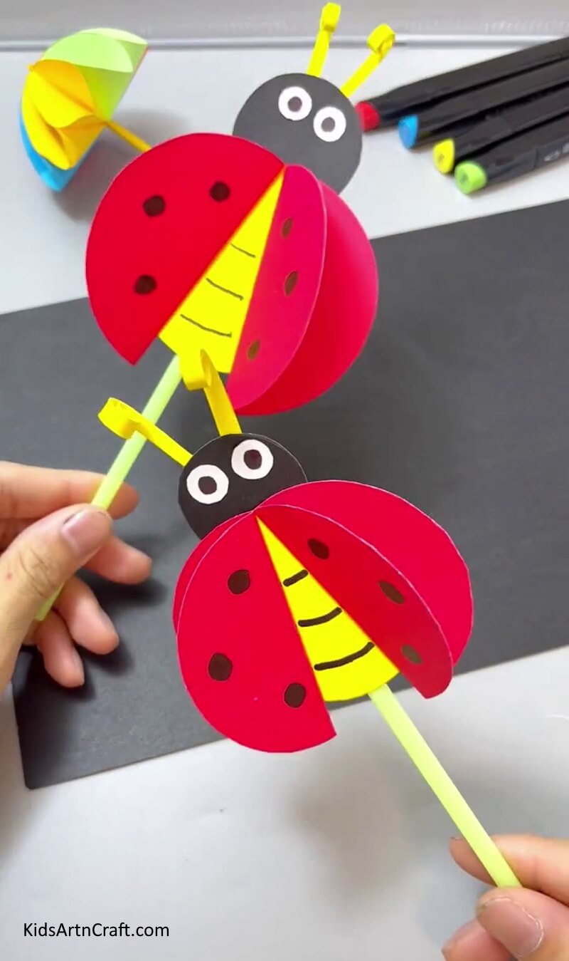 Crafting a ladybug with paper for kids.