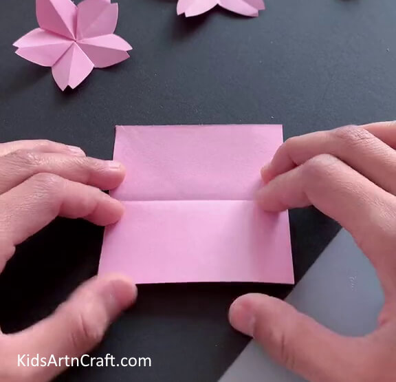 Taking A Square-Shaped Origami Paper - Here's a handcrafted Origami flower project with explicit directions.