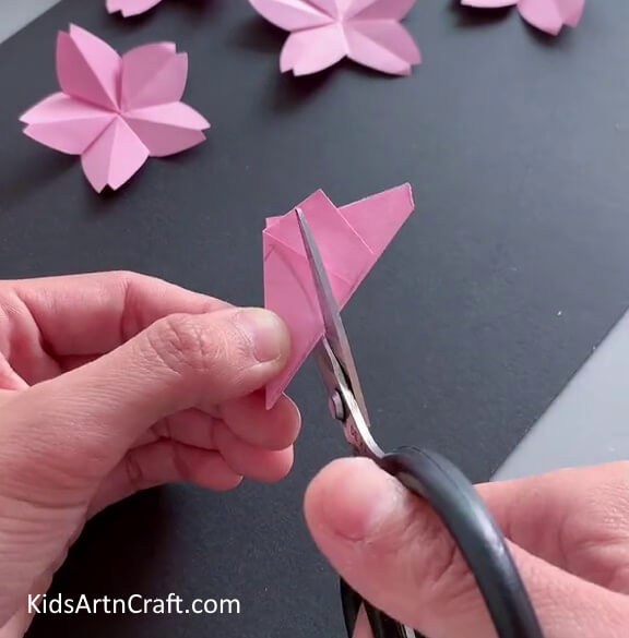 Folding Paper In Half And Cutting - Get the directions you need to make an exquisite Origami flower.