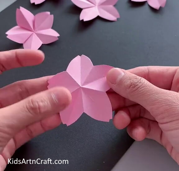 Unfolding Paper Flower - This tutorial provides clear instructions for crafting a paper flower.