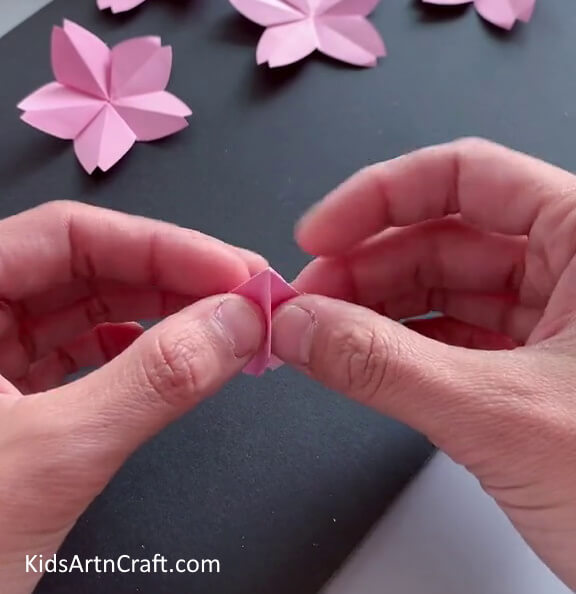 Folding Paper Flower in Opposite Direction - Become an Origami flower expert with the help of this tutorial.