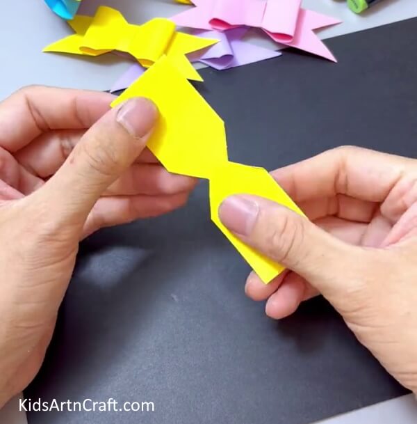 Unfolding The Paper - Construct a Simple Paper Bow Creation with Children