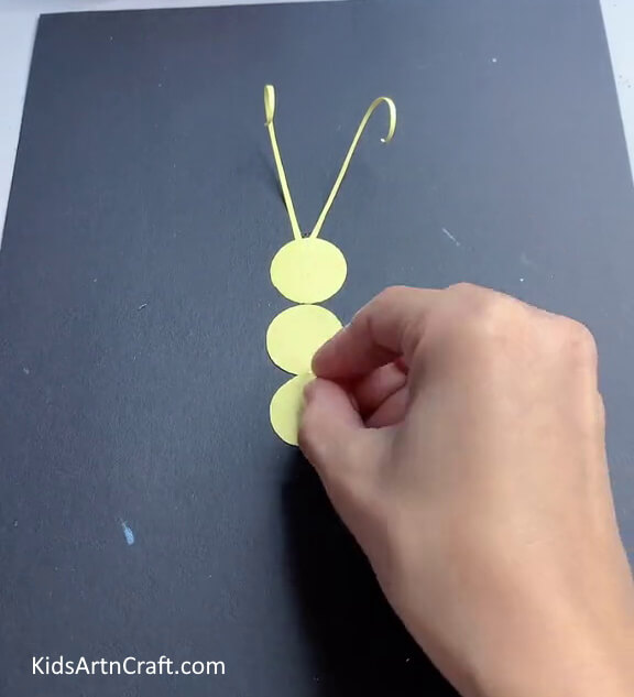 Pasting More Yellow Circles - Paper Butterfly Construction: A Guide for Little Crafters