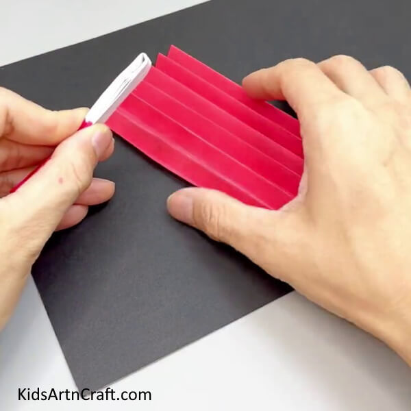 Making Zigzag Strips From Another Paper - Crafting a Paper Doll Creation For Toddlers