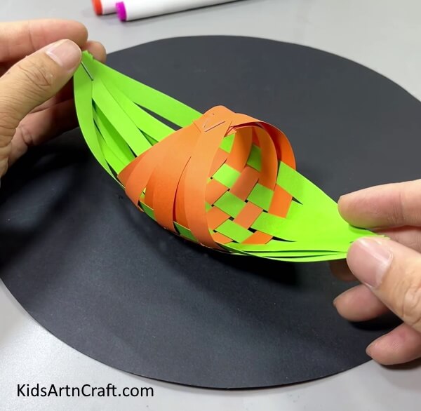 Pasting The Boat On The Black Circle - How to Assemble a Paper Strip Boat with this Kids Craft