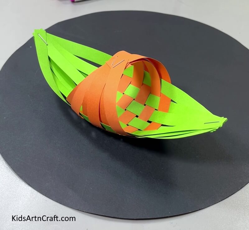 A Tutorial to Help Kids Create a Boat Out of Paper Strips