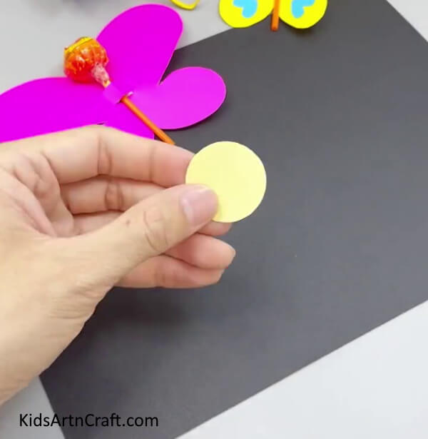 Cutting A Yellow Paper Circle - Crafting a Paper Butterfly - Quick Tutorials for Youngsters