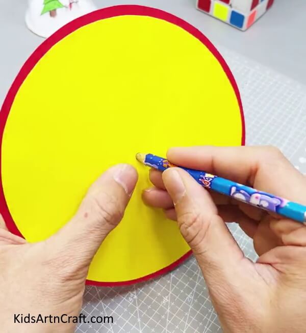 Making A Hole In Between The Circle - Guide to Constructing a Paper Clock with Kids