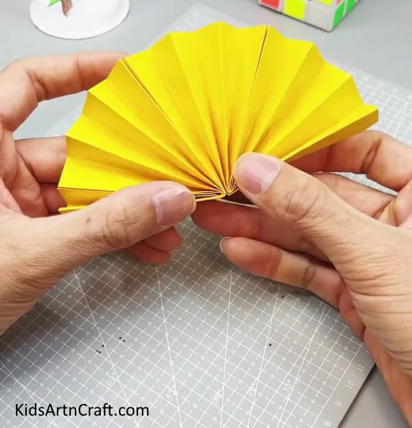 Pasting Two Fans Together - Making a Fun Paper Fan Toy Activity for Kids