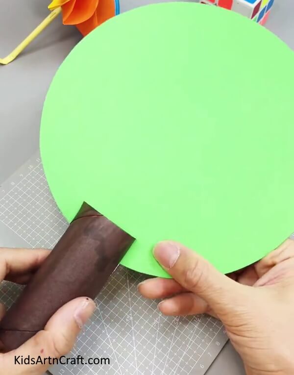 Pasting Green Circle On Cardboard Tube - Step-by-Step Guide to Making a Paper Flower Tree with Kids 