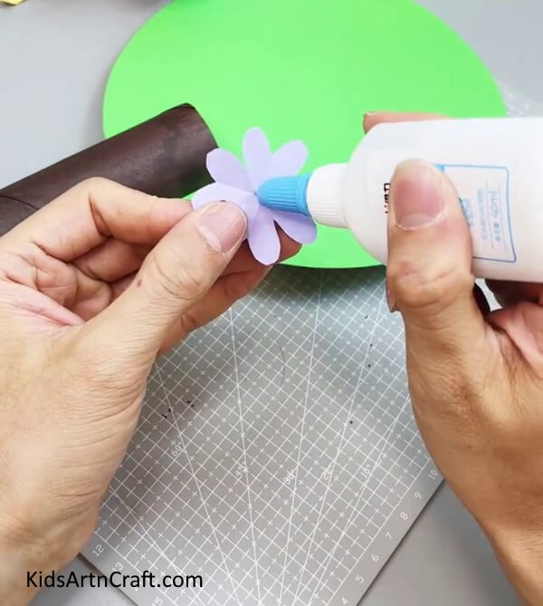 Applying Glue - Step-by-Step Guide to Crafting a Paper Flower Tree with Kids 