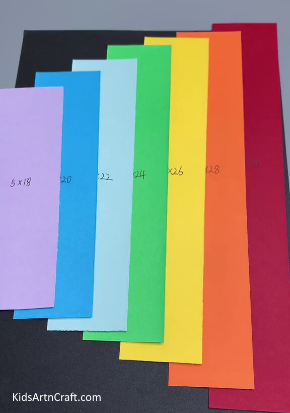Cutting Rainbow Colored Strips - Learn How To Create a Rainbow Cloud Decoration By Using Paper Strips