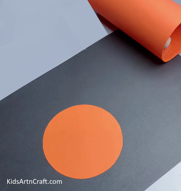 Cutting Out An Orange Paper Circle - Creating a Paper Tiger by Hand for Children