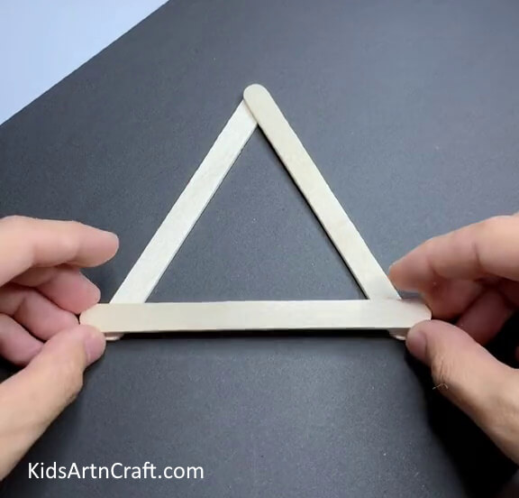 Forming A Triangle Using a Popsicle Stick - A fun and easy activity for kids to make a shark out of popsicle sticks.