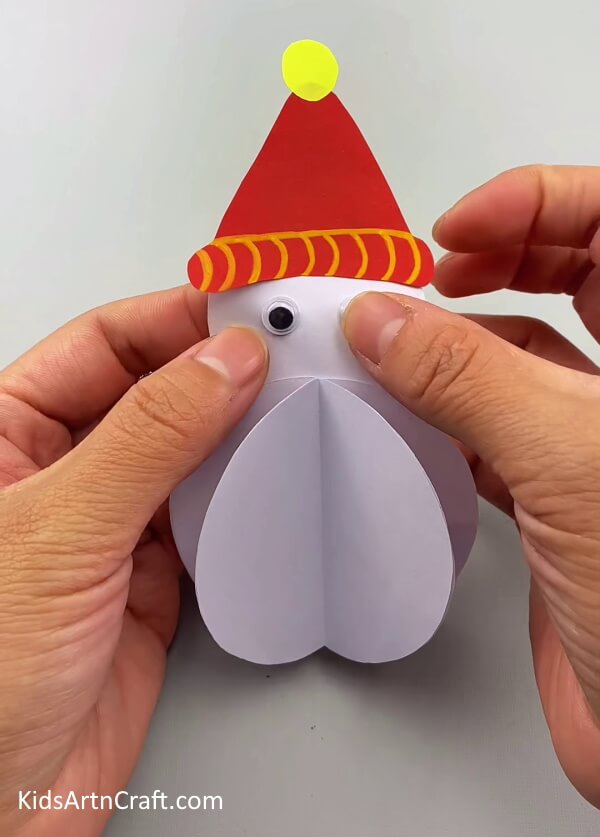 Add a pair of eyes- Kid-Friendly 3D Snowman Craft Tutorial Using Paper