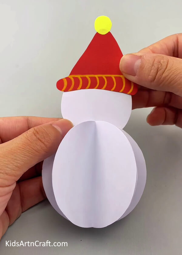 Making a conical cap for the snow man- An Easy 3D Snowman Paper Craft Tutorial For Youngsters