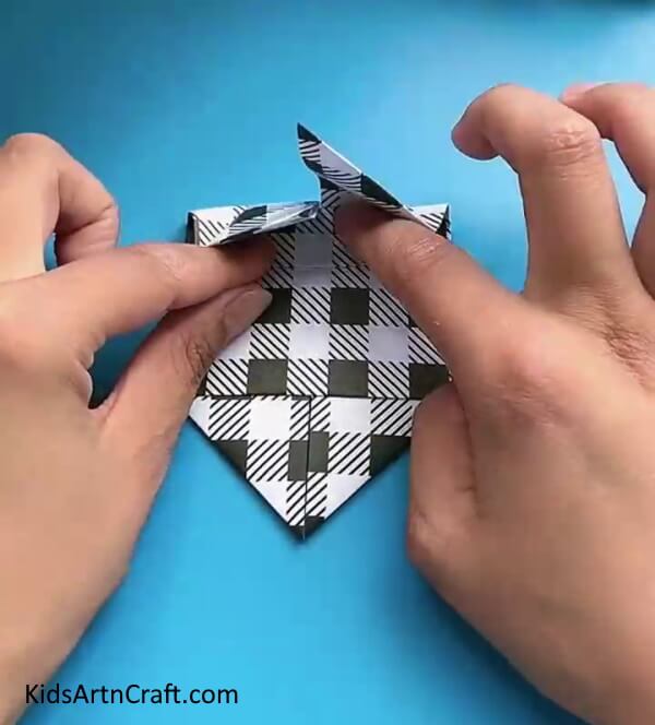 Fold The Crease From Above-A tutorial for children to make a paper butterfly