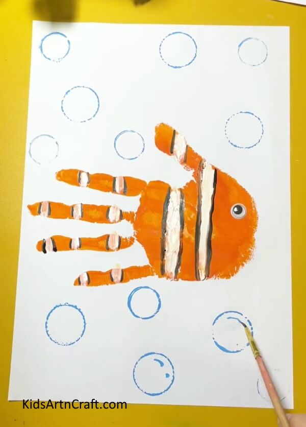Making water bubbles- An Easy Guide to Crafting Handprint Fish