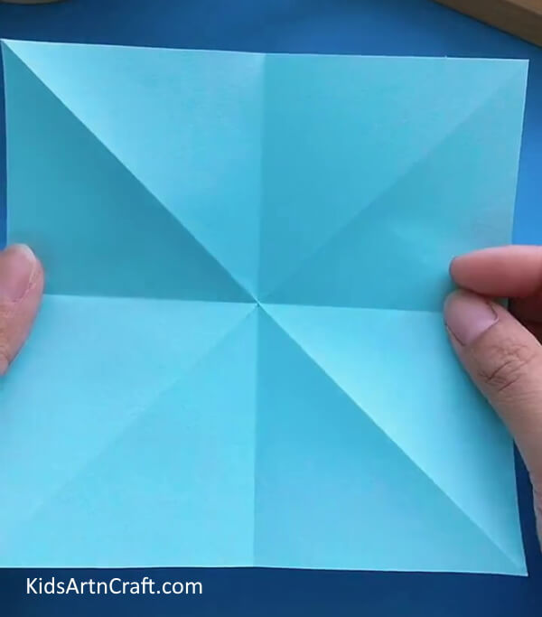Take a Blue Sheet Of Paper-Constructing a Paper Airplane Using Origami for Minors 