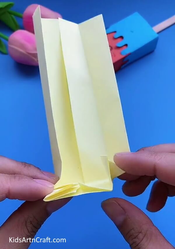 Make Folds From The Bottom Of The Cream Craft Paper-An Easy-To-Follow Ice Cream Box Craft Tutorial For Kids 