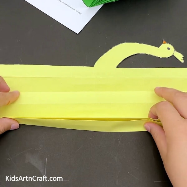 Create A Folds One After The Other-A Step-by-Step Guide to Crafting a Paper Peacock for preschoolers