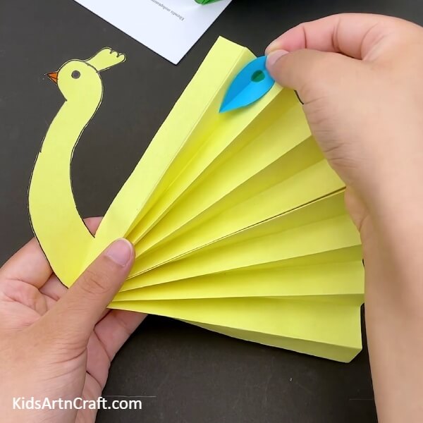 Paste The Peacock Design Cutout-An Easy-to-Follow Guide to Constructing a Paper Peacock Craft for Beginners
