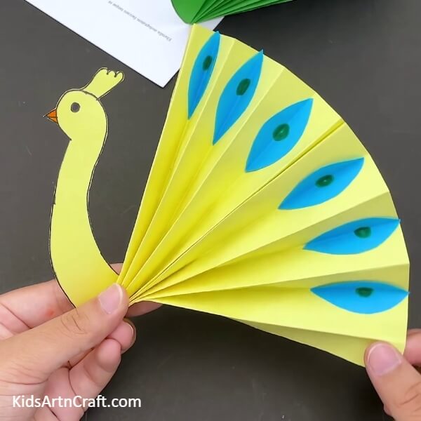 Instructional guide for creating a Paper Peacock for Children