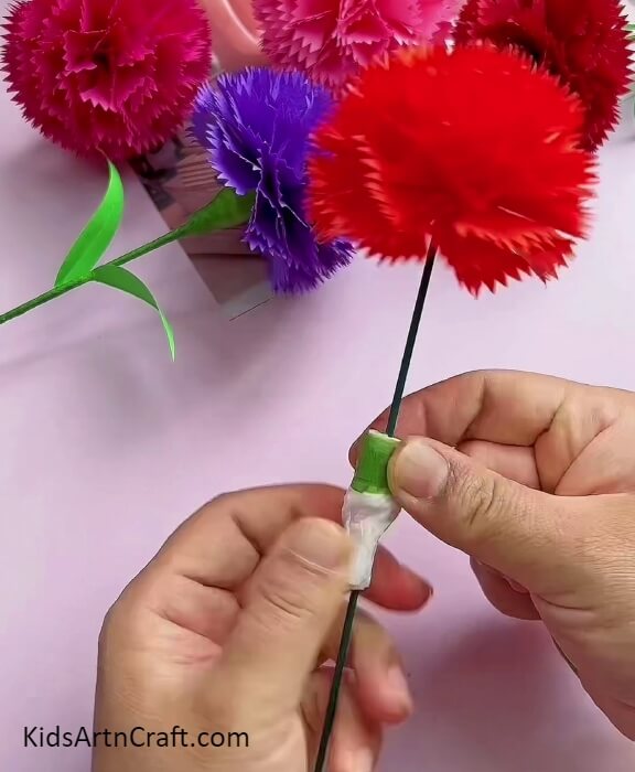 Roll Another Tissue Paper on the Green Paper Clip- Craft Gorgeous Carnation Paper Blooms With This Tutorial for Beginners 