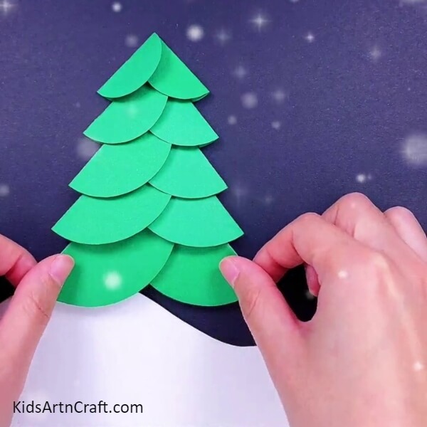 Similarly add more and more such cutouts- Alluring Christmas Tree Paper Crafts For Youngsters