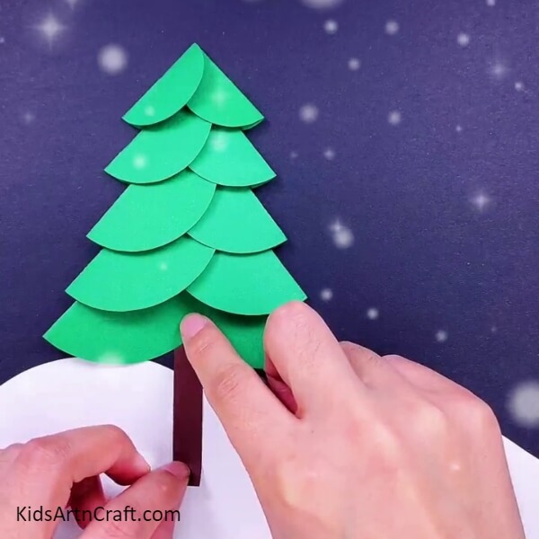 Paste the tree trunk cutout Enchanting Christmas Tree Paper Arts For Kids