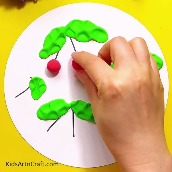 Making cherries with the red modelling clay- Step-by-step Directions to Making Lovely Clay Cherries for Kids 