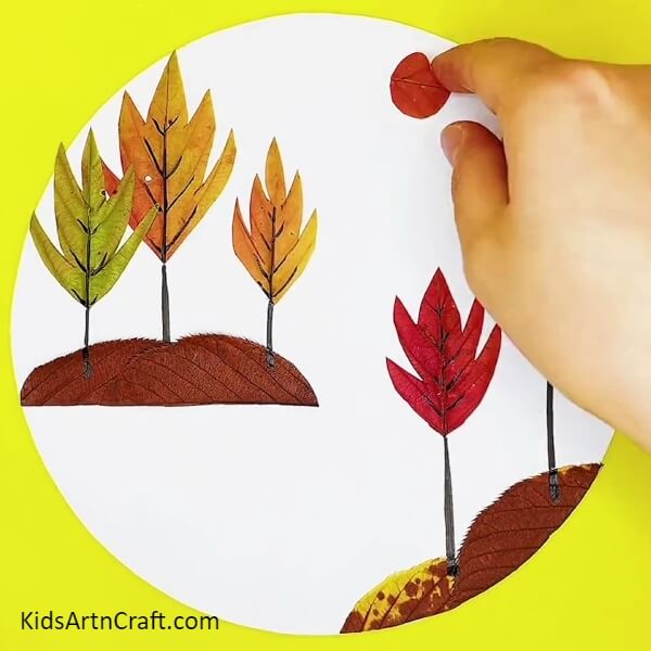 Adding A Sun- A Guide to Making a Fall Leaf Landscape Art Work for Youngsters