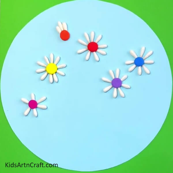 Repeating The Steps To Make More Flowers- Instructions for producing a flower garden art piece with cotton earbuds for children