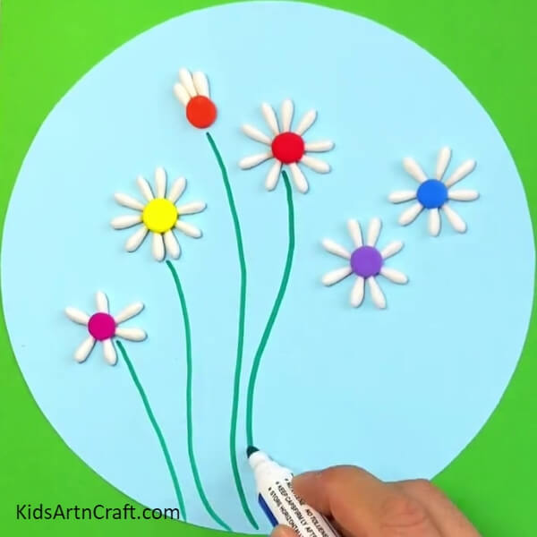 Draw The Stems Using Green Marker-Step-by-step tutorial to put together a beautiful flower garden project with cotton buds for children