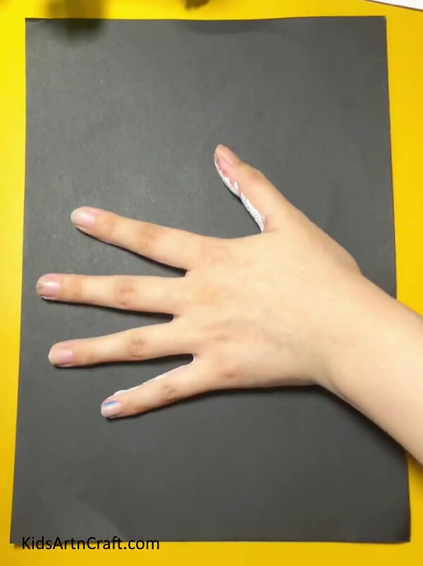 Stamping on the sheet of paper.- Magnificent Handprint Swan Activity Guide For Newbies