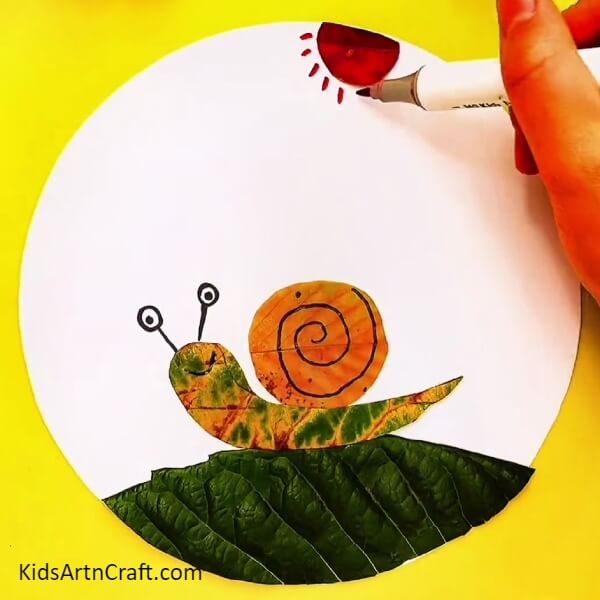 With A Red Or Orange Sketch Pen Draw The Sun-Guide to Crafting a Beautiful Leaf Snail - Ideal for Learners