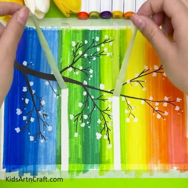 Carefully Remove The Tape From The Sheet-Charming Rainbow Tree Vista Through A Window Artwork For Youngsters