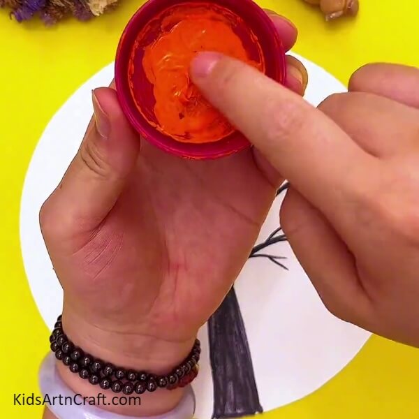 Dip your Finger in Orange Colour for Beautiful Tree Fingerprint Painting