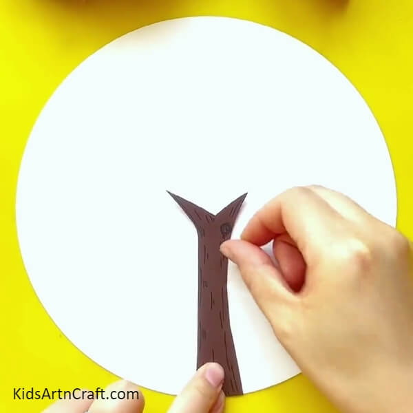 Pasting A Tree Trunk-Leaf imprints are utilized to create a stunning tree painting, a tutorial for kids